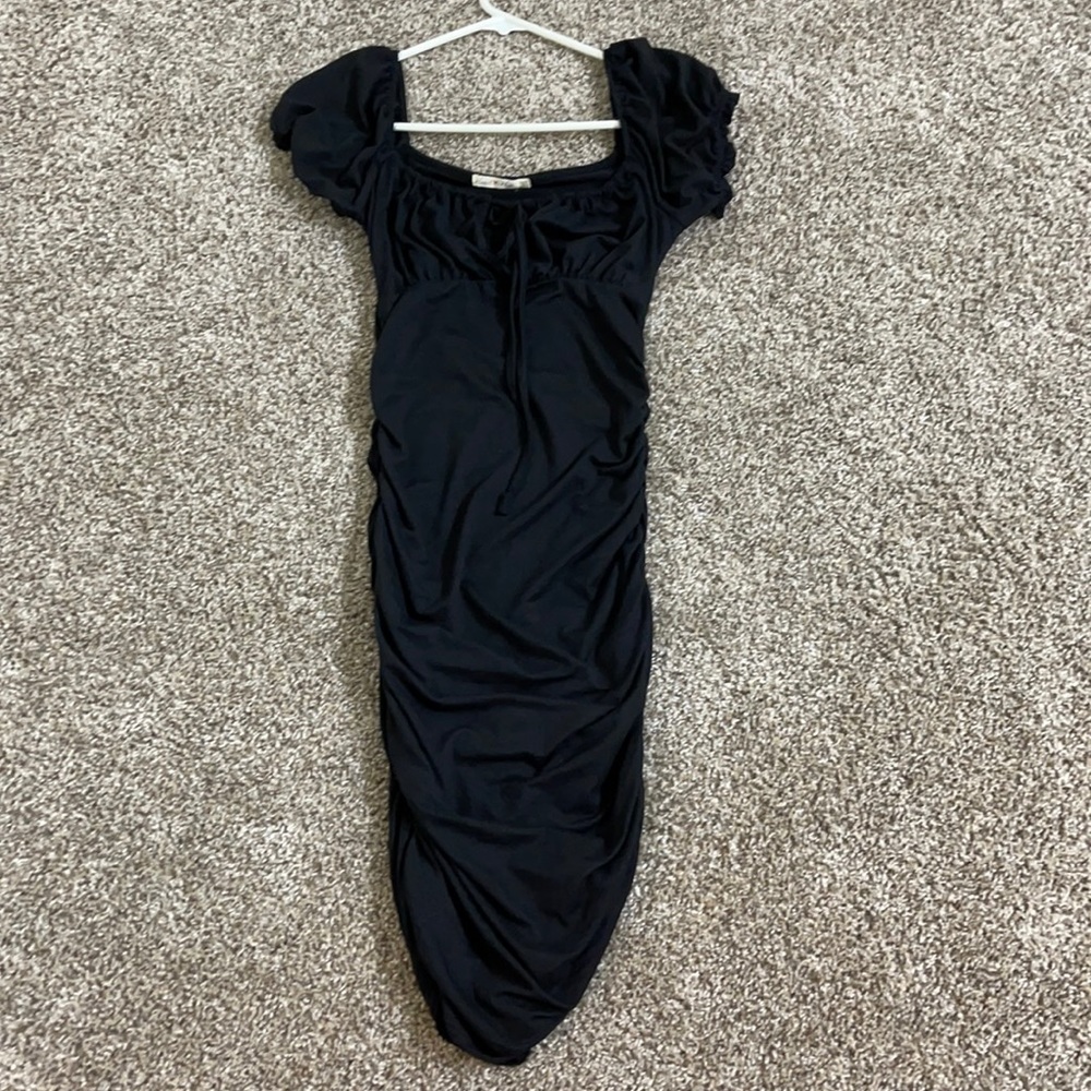 It’s a tight black dress